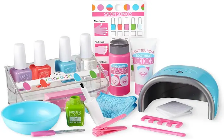 Colorful manicure and pedicure kit with nail polishes, UV lamp, remover, lotion, tools, foot bath, and salon services chart on white background.